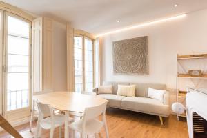 A seating area at Urbe10 Plaza de la Constitucion 1 Bedroom Apartment