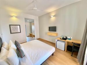 TV a/nebo společenská místnost v ubytování Amigos Candolim Beach