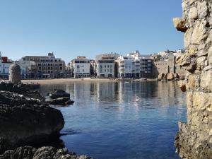 a view of a body of water with buildings at Pensió Vista Alegre in L'Escala