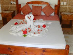 Postel nebo postele na pokoji v ubytování Rising Sun Guesthouse