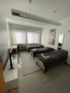 Ένα ή περισσότερα κρεβάτια σε δωμάτιο στο Hostel400Kokkola Mannerheiminaukio +35 φωτογραφίες