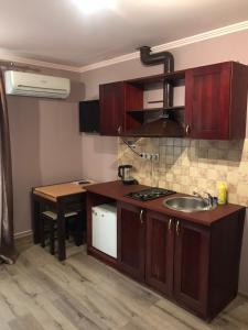 Η κουζίνα ή μικρή κουζίνα στο Best Rest Suites
