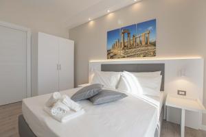 Postel nebo postele na pokoji v ubytování Esseneto Rooms