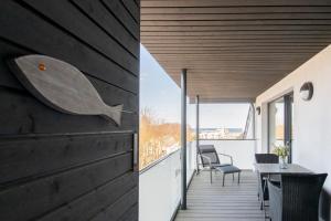 a house with a whale head on the wall at Badeweg 7 Humphrey Bogard in Scharbeutz