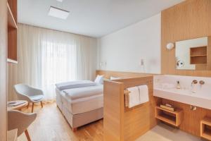 Postel nebo postele na pokoji v ubytování Hotel Central