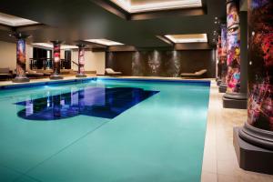 a large swimming pool in a hotel room at NYX Hotel London Holborn by Leonardo Hotels in London