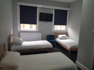 Posteľ alebo postele v izbe v ubytovaní Piccadilly Central