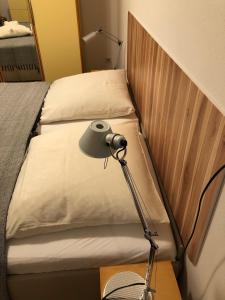 Postel nebo postele na pokoji v ubytování Angekommen