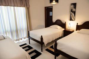 Postel nebo postele na pokoji v ubytování Guesthouse A Lareira
