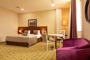 Postel nebo postele na pokoji v ubytování West Shine Hotel