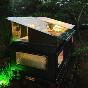 a house with a glass roof on top of a microwave at Masinga in Hillcrest