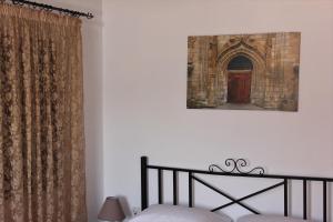 A bed or beds in a room at Traditional Stone house