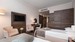 Postel nebo postele na pokoji v ubytování Hotel Różany Gaj - Destigo Hotels