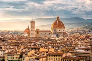 a view of a city with mountains in the background at CASA SOSSI in San Piero a Sieve