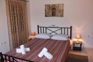 A bed or beds in a room at Traditional Stone house