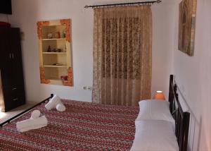 A bed or beds in a room at Traditional Stone house