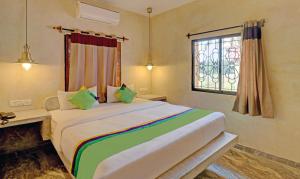 Treebo Sava Resort with Pool客房内的一张或多张床位