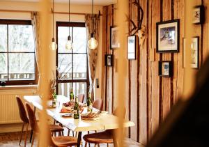 a dining room with a table and chairs at Chalet Anton in Kurort Oberwiesenthal