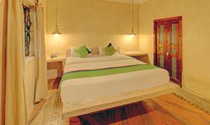 Treebo Sava Resort with Pool客房内的一张或多张床位
