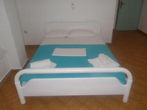 Cama ou camas em um quarto em Princess Santorini Villa