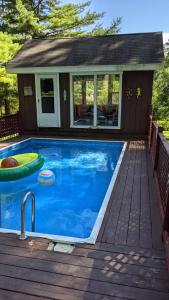 a swimming pool on a deck next to a house at Private Berkshire Escape Special April Pricing select your dates for discount Monthly Pricing in Lee