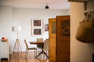 a dining room with a table and chairs at Amazing Tailor Made Penthouse by the Beach #1 in Oeiras +18 photos