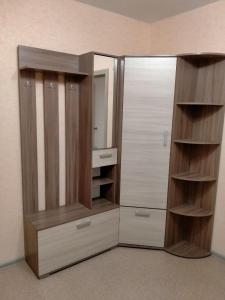 a large closet with a mirror and a sink at Sunflower Aparts 36 in Voronezh