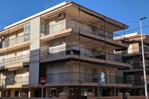 an apartment building with balconies on the side of it at Apartamento H9 Gran Playa con vistas al mar in Santa Pola