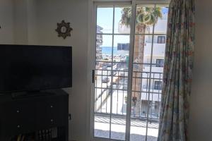 Et tv og/eller underholdning på Apartamento H9 Gran Playa con vistas al mar