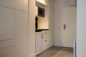 Kuchyňa alebo kuchynka v ubytovaní TPS Apartamenty Olimpijskie