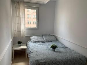 Łóżko lub łóżka w pokoju w obiekcie Pisos con piscina de temporada corta estancia