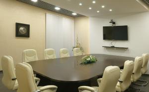 a conference room with a table and chairs at Salut Hotel in Balakovo