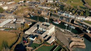 an aerial view of a house with a marina at Pier House in St Austell