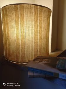 a stack of books sitting on top of a chair at Agula Relais camera matrimoniale in Pugnano