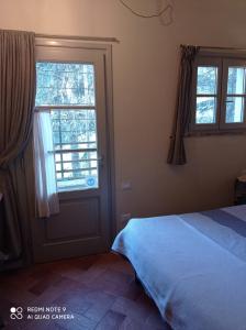 A bed or beds in a room at Agula Relais camera matrimoniale