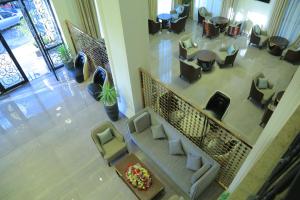 an overhead view of a lobby with couches and chairs at Check Inn Hotel Addis Ababa in Addis Ababa