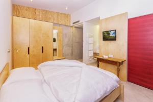 Кровать или кровати в номере Kleinkunsthotel