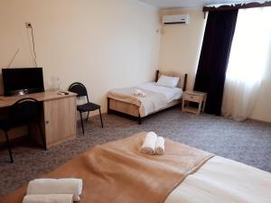 Ліжко або ліжка в номері Отель на Садовой