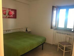 Кровать или кровати в номере Appartamenti Estivi Anna e Pino