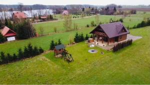 an aerial view of a house on a green field at Wierzbowy Zakątek in Prostki