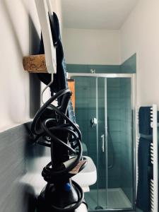 a hair dryer sitting on a counter in a bathroom at Dolce Nera B&B in Narni Scalo +15 photos