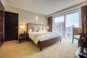 Postel nebo postele na pokoji v ubytování Exuberant 1BR at The Address Residences Dubai Marina by Deluxe Holiday Homes + 24 fotografií