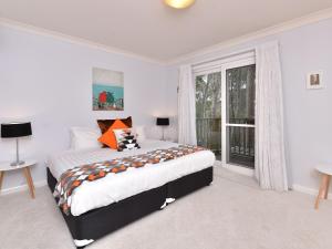 A bed or beds in a room at Villa 3br Penivity located within Cypress Lakes Resort