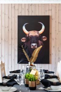 a picture of a bull with horns on a wall at In the middle of Trysilfjellet - Welcome Center - Apartment with 3 bedrooms - By bike arena and ski lift in Trysil