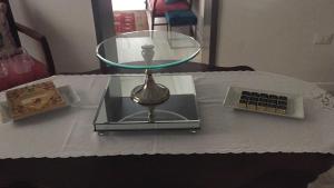 a table with a glass table top with a glass table at Archè in Syracuse