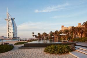 a view of a resort with a building in the background at Jumeirah Mina Al Salam Dubai in Dubai