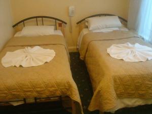 Postel nebo postele na pokoji v ubytování Hotel Sophia