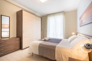 Postel nebo postele na pokoji v ubytování Residenze Roscioli