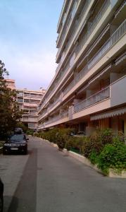 a car parked in front of a large building at Le Minerve in Menton