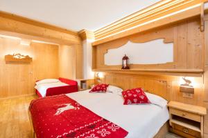 Voodi või voodid majutusasutuse Hotel Aurora toas